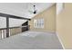 Spacious bonus room with vaulted ceilings, ceiling fan, and large windows at 6417 S Florence Way, Englewood, CO 80111