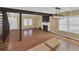 Living room featuring wood floors, stairs, fireplace, and contemporary light fixtures at 6417 S Florence Way, Englewood, CO 80111