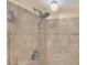 Shower with tiled walls, shower head and glass door at 6417 S Florence Way, Englewood, CO 80111