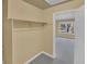 View of walk-in closet leading to a bedroom with large windows at 6417 S Florence Way, Englewood, CO 80111