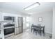 Modern kitchen with white cabinets, stainless steel appliances, and granite countertops at 710 S Oakland St, Aurora, CO 80012