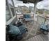 Back porch features an outdoor seating area with cushioned chairs and tables at 965 Peach Leaf Ln, Elizabeth, CO 80107