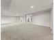 Spacious finished basement offering ample room with plush carpeting and neutral color palette at 965 Peach Leaf Ln, Elizabeth, CO 80107