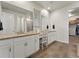 Bathroom features double sinks with granite countertops and decorative lighting at 965 Peach Leaf Ln, Elizabeth, CO 80107