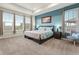 Serene bedroom features natural light, tray ceilings, and views at 965 Peach Leaf Ln, Elizabeth, CO 80107