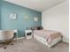 Bedroom features a work space, a single bed, and three wall decorations at 965 Peach Leaf Ln, Elizabeth, CO 80107