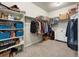 Walk-in closet has ample storage with multiple shelves and racks at 965 Peach Leaf Ln, Elizabeth, CO 80107