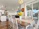 Charming dining room with stylish furniture, natural light from sliding glass doors and views of the kitchen at 965 Peach Leaf Ln, Elizabeth, CO 80107