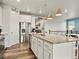 Spacious kitchen boasts a large island with granite countertops, stainless steel appliances, and ample cabinet space at 965 Peach Leaf Ln, Elizabeth, CO 80107
