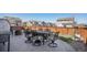 A patio is furnished with a dark metal outdoor dining set, with a dark brown privacy fence in the background at 965 Peach Leaf Ln, Elizabeth, CO 80107