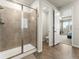 Walk-in shower features a glass enclosure and tile surround at 965 Peach Leaf Ln, Elizabeth, CO 80107