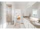 Bright bathroom boasts dual sinks with granite countertops, walk-in shower, and neutral tones for a modern, spa-like feel at 3231 Riverwood Way, Castle Rock, CO 80109