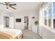 Spacious main bedroom features a walk-in closet, en suite bath, plush carpeting, and large window for bright natural light at 3231 Riverwood Way, Castle Rock, CO 80109