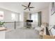 Bright bonus room features comfortable seating and a dedicated desk space with modern ceiling fan and neutral color palette at 3231 Riverwood Way, Castle Rock, CO 80109