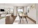 Light-filled dining room featuring backyard views, seating for six, and seamlessly connected to the living areas at 3231 Riverwood Way, Castle Rock, CO 80109
