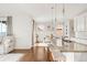 Bright kitchen featuring stainless steel appliances, granite countertops, and a breakfast bar at 3231 Riverwood Way, Castle Rock, CO 80109