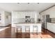 Modern kitchen with granite countertops, stainless steel appliances, and large kitchen island with barstools at 3231 Riverwood Way, Castle Rock, CO 80109