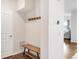 A tidy mud room featuring a coat rack, wooden bench, and a doorway to another room at 3231 Riverwood Way, Castle Rock, CO 80109