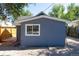 Exterior view of the side and back of home with large window at 665 S Meade St, Denver, CO 80219