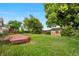 Backyard features a small wooden shed on a grassy yard at 10330 Melody Dr, Northglenn, CO 80260
