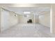 Unfinished basement with white walls and carpeted floors, offering potential for customization at 10330 Melody Dr, Northglenn, CO 80260