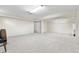 Spacious basement area with neutral carpet and ample room for various activities or storage at 10330 Melody Dr, Northglenn, CO 80260