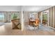 Formal dining room featuring a chandelier, wood table and chairs, with an entryway to another room at 10330 Melody Dr, Northglenn, CO 80260