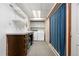 Convenient laundry room offers ample storage and modern washer and dryer at 10330 Melody Dr, Northglenn, CO 80260