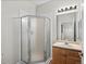 Bathroom features a corner shower and wood vanity at 4005 S Dillon Way # 102, Aurora, CO 80014