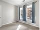 Well-lit bedroom with neutral walls, carpet, and large windows at 4005 S Dillon Way # 102, Aurora, CO 80014