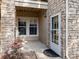 Exterior entryway with stone facade and double windows at 4005 S Dillon Way # 102, Aurora, CO 80014