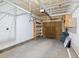 Attached garage with overhead storage shelving at 4005 S Dillon Way # 102, Aurora, CO 80014