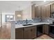 Modern kitchen with stainless steel appliances and stylish backsplash at 4005 S Dillon Way # 102, Aurora, CO 80014