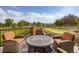 Outdoor dining area featuring seating, outdoor table and backyard putting green at 3191 W 151St Ct, Broomfield, CO 80023