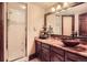 Updated bathroom featuring a bowl sink, unique faucet, and a walk-in shower with glass door at 3191 W 151St Ct, Broomfield, CO 80023