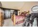Bright bedroom with natural light, vaulted ceiling, built-in storage, and a comfortable massage chair at 3191 W 151St Ct, Broomfield, CO 80023