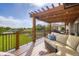 Relaxing deck showcases a cozy outdoor lounge area with a soft couch and pergola at 3191 W 151St Ct, Broomfield, CO 80023