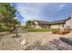 Exterior view of the home showing rock landscaping, green grass and a large lawn at 3191 W 151St Ct, Broomfield, CO 80023