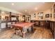 Open game room featuring a pool table, hardwood floors, and access to the wet bar at 3191 W 151St Ct, Broomfield, CO 80023