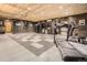 Finished garage includes space for working out, checkerboard floors, wood walls and cabinets for storage at 3191 W 151St Ct, Broomfield, CO 80023