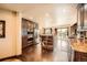 Gourmet kitchen featuring stainless steel appliances, an island with seating, and wooden cabinets at 3191 W 151St Ct, Broomfield, CO 80023