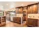 Gourmet kitchen with granite countertops, custom cabinets, and a hidden pantry at 3191 W 151St Ct, Broomfield, CO 80023