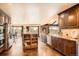 Spacious kitchen features custom cabinetry, granite countertops, stainless steel appliances, and views to the outside at 3191 W 151St Ct, Broomfield, CO 80023