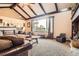 Cozy living room with large picture window, comfortable seating, and neutral carpeting offers a relaxing retreat at 3191 W 151St Ct, Broomfield, CO 80023