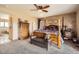 Comfortable primary bedroom features a four-poster bed, custom wall texture, and ample space for relaxation at 3191 W 151St Ct, Broomfield, CO 80023
