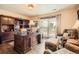 Comfortable home office featuring a large desk and lots of natural light from the sliding glass door at 3191 W 151St Ct, Broomfield, CO 80023