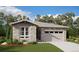 Single-story home with stone accents and a two-car garage at 24779 E 39Th Ave, Aurora, CO 80019