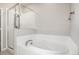 Bathroom featuring a stand alone tub and glass shower, creating a spa-like feel at 185 Ambrose St, Erie, CO 80516