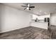 Open-concept living area featuring modern hardwood floors and kitchen at 185 Ambrose St, Erie, CO 80516
