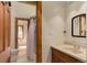 Bathroom with shower and neutral vanity and mirror combination at 205 Yankee Creek Trl, Evergreen, CO 80439